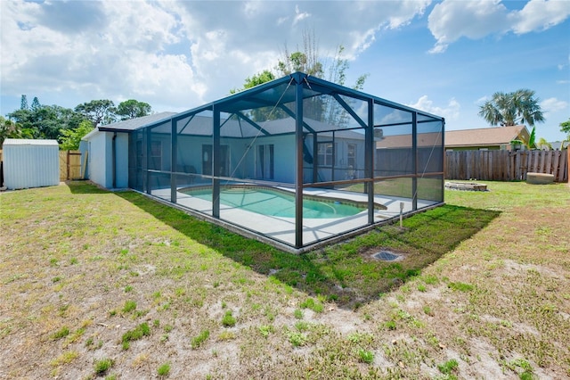 4068 Palau Dr, Sarasota, FL 34241 - view of swimming pool featuring a fenced backyard, a storage shed, and glass enclosure