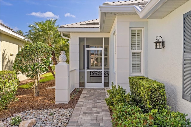 1625 Lancashire Dr, Venice, FL 34293 - property entrance featuring a tiled roof and stucco siding