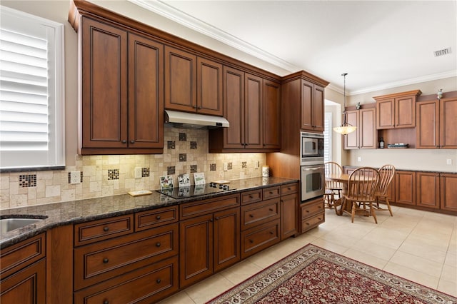 1625 Lancashire Dr, Venice, FL 34293 - kitchen with under cabinet range hood, light tile patterned floors, black electric cooktop, and visible vents
