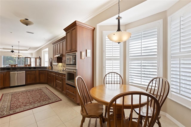 1625 Lancashire Dr, Venice, FL 34293 - dining room with light tile patterned floors, baseboards, ornamental molding, and visible vents