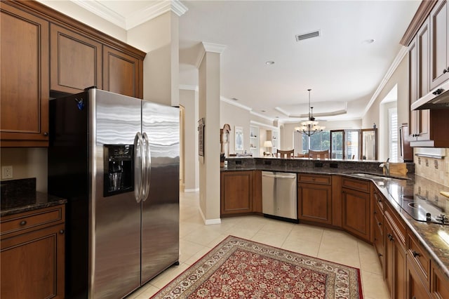 1625 Lancashire Dr, Venice, FL 34293 - kitchen featuring crown molding, light tile patterned floors, an inviting chandelier, visible vents, and stainless steel appliances