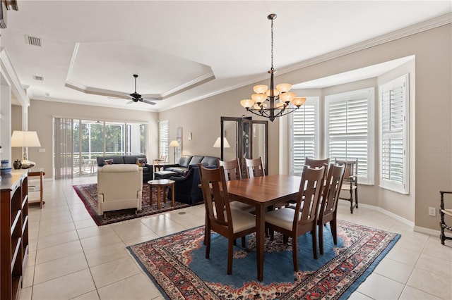 1625 Lancashire Dr, Venice, FL 34293 - dining area with ornamental molding, a tray ceiling, and light tile patterned floors