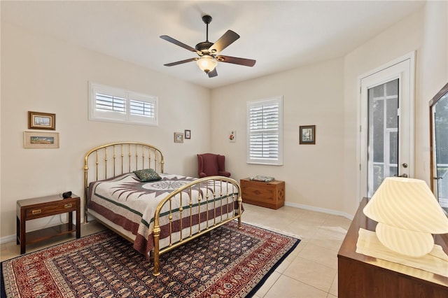1625 Lancashire Dr, Venice, FL 34293 - bedroom with ceiling fan, access to exterior, light tile patterned floors, and baseboards