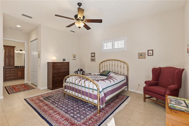 1625 Lancashire Dr, Venice, FL 34293 - bedroom with light tile patterned floors, visible vents, baseboards, and ensuite bath