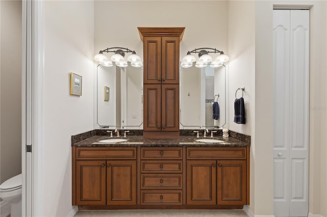 1625 Lancashire Dr, Venice, FL 34293 - full bathroom featuring double vanity, a closet, a sink, and toilet