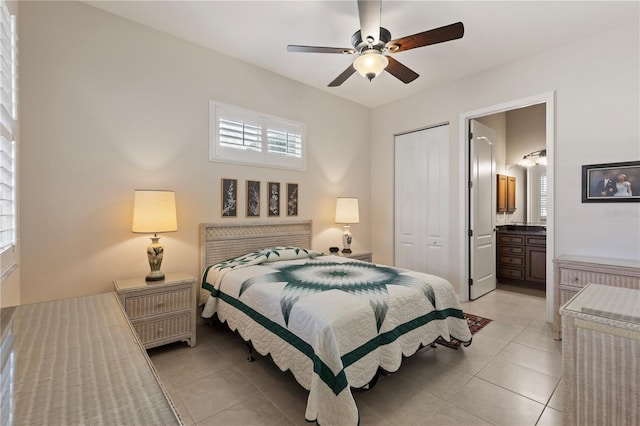 1625 Lancashire Dr, Venice, FL 34293 - bedroom with a closet, ceiling fan, connected bathroom, and light tile patterned floors