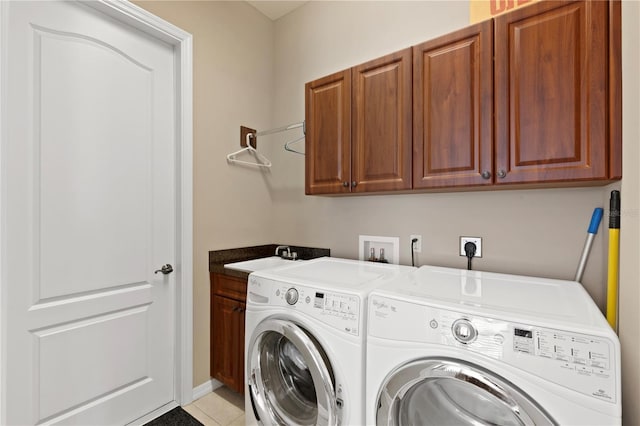 1625 Lancashire Dr, Venice, FL 34293 - washroom featuring independent washer and dryer, light tile patterned floors, a sink, and cabinet space