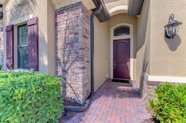 24193 Gallberry Dr, Venice, FL 34293 - doorway to property with stone siding and stucco siding