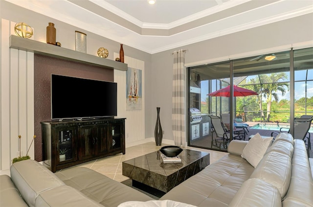 24193 Gallberry Dr, Venice, FL 34293 - living room featuring baseboards, recessed lighting, light tile patterned floors, crown molding, and a tray ceiling