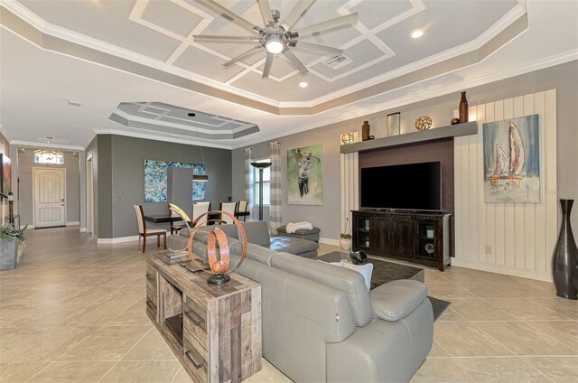 24193 Gallberry Dr, Venice, FL 34293 - living room with ornamental molding, a raised ceiling, light tile patterned flooring, and a ceiling fan