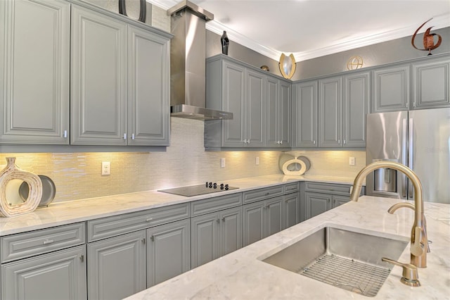 24193 Gallberry Dr, Venice, FL 34293 - kitchen featuring a sink, freestanding refrigerator, gray cabinetry, and wall chimney exhaust hood
