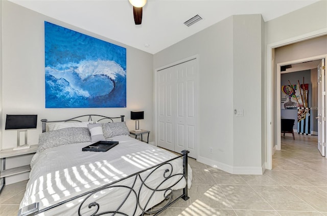 24193 Gallberry Dr, Venice, FL 34293 - bedroom with a closet, baseboards, light tile patterned floors, a ceiling fan, and visible vents