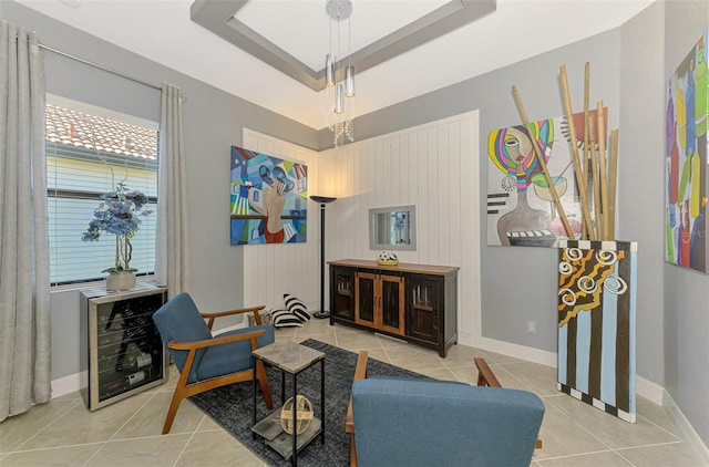24193 Gallberry Dr, Venice, FL 34293 - sitting room featuring baseboards, a raised ceiling, and tile patterned flooring