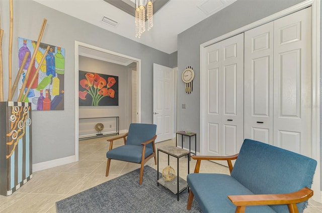 24193 Gallberry Dr, Venice, FL 34293 - living area featuring a chandelier, visible vents, baseboards, and light tile patterned flooring
