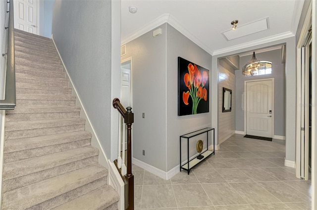 24193 Gallberry Dr, Venice, FL 34293 - entrance foyer with ornamental molding, baseboards, stairway, and light tile patterned flooring