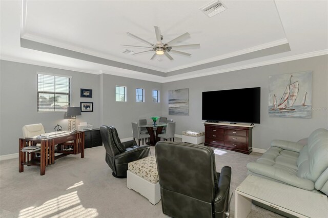 24193 Gallberry Dr, Venice, FL 34293 - living room featuring a wealth of natural light, visible vents, a tray ceiling, and ceiling fan