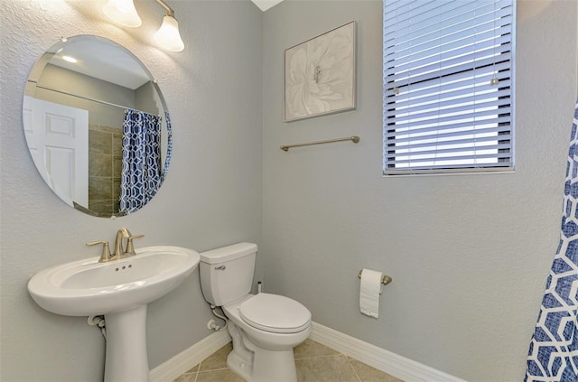 24193 Gallberry Dr, Venice, FL 34293 - bathroom with tile patterned flooring, baseboards, and toilet