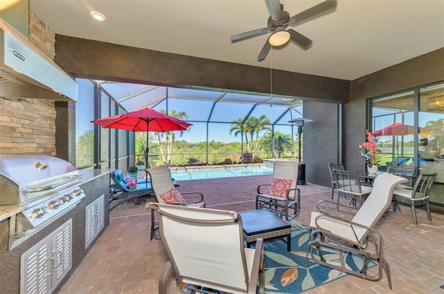 24193 Gallberry Dr, Venice, FL 34293 - view of patio with a grill, a ceiling fan, exterior kitchen, glass enclosure, and an outdoor pool