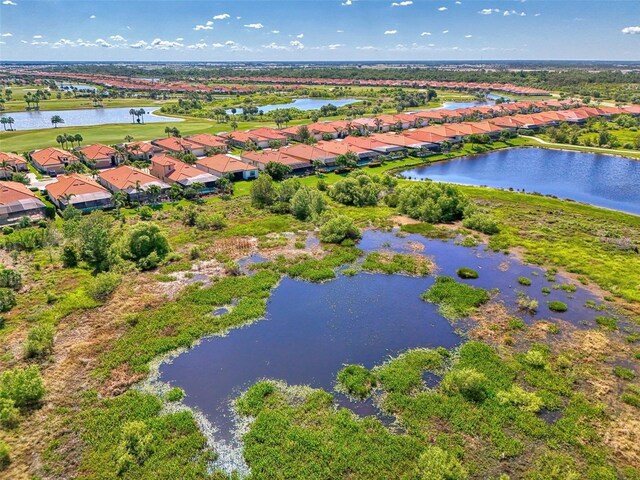 24193 Gallberry Dr, Venice, FL 34293 - bird's eye view featuring a water view, view of golf course, and a residential view