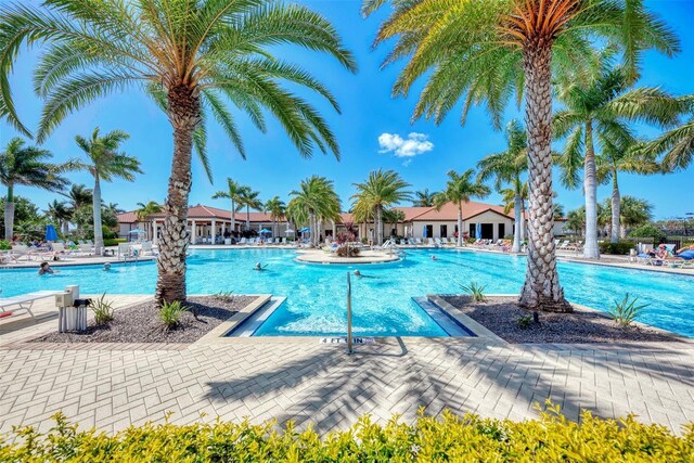 24193 Gallberry Dr, Venice, FL 34293 - community pool featuring a patio area
