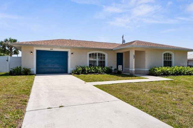 511 Porpoise Rd, Venice, FL 34293 - ranch-style home featuring a front lawn, an attached garage, concrete driveway, and stucco siding