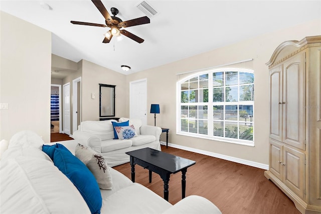 511 Porpoise Rd, Venice, FL 34293 - living area with lofted ceiling, wood finished floors, visible vents, a ceiling fan, and baseboards