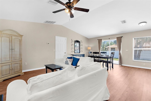511 Porpoise Rd, Venice, FL 34293 - living room featuring ceiling fan, vaulted ceiling, wood finished floors, and visible vents