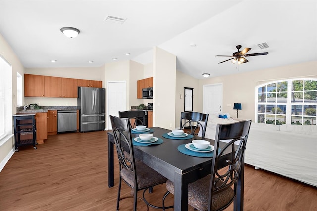 511 Porpoise Rd, Venice, FL 34293 - dining area with lofted ceiling, wood finished floors, and visible vents