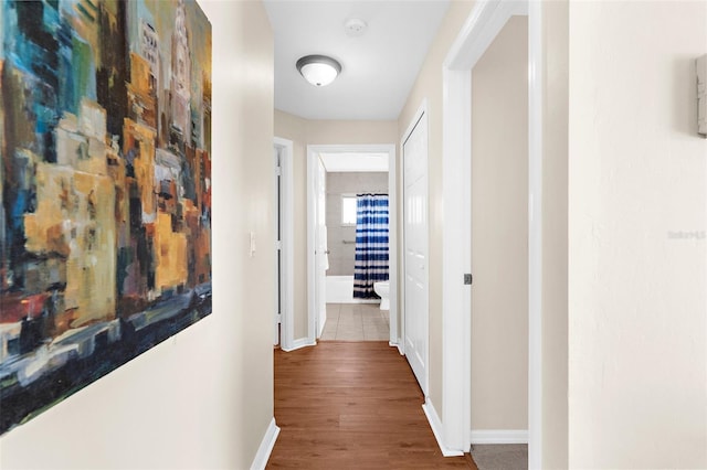 511 Porpoise Rd, Venice, FL 34293 - hall featuring baseboards and wood finished floors