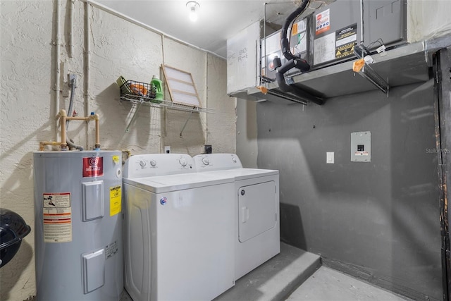 511 Porpoise Rd, Venice, FL 34293 - washroom featuring washing machine and dryer, a textured wall, water heater, and laundry area