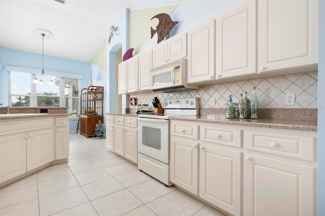 kitchen featuring tasteful backsplash, white appliances, light tile patterned flooring, decorative light fixtures, and a sink