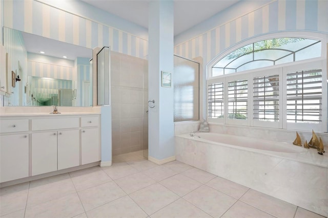 bathroom featuring tile patterned floors, walk in shower, a garden tub, and wallpapered walls