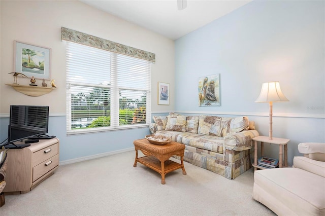 living room with light colored carpet and baseboards