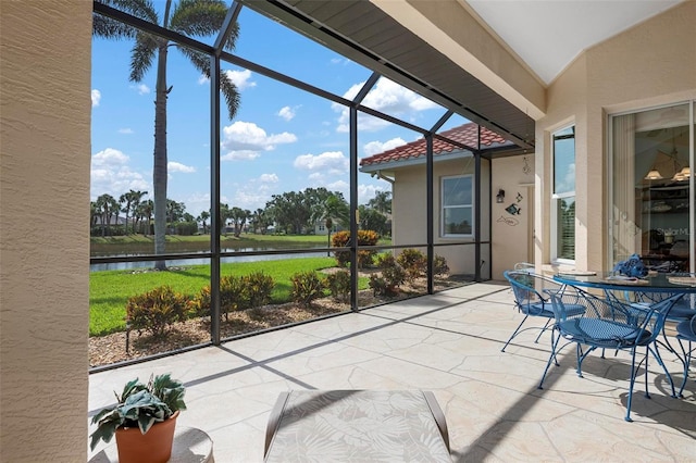 sunroom with a water view
