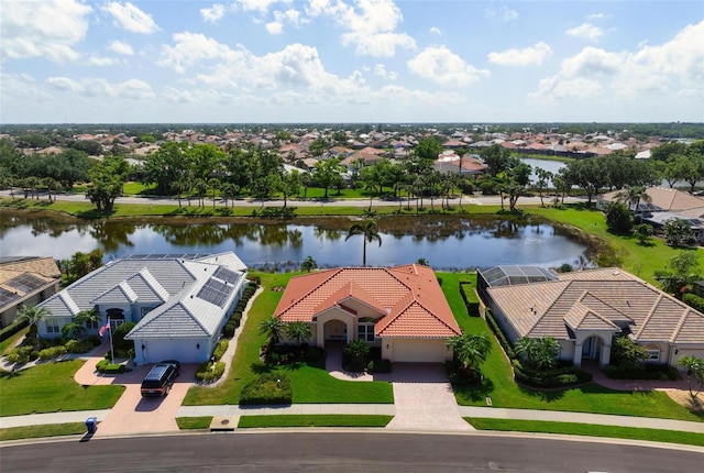 birds eye view of property with a residential view and a water view
