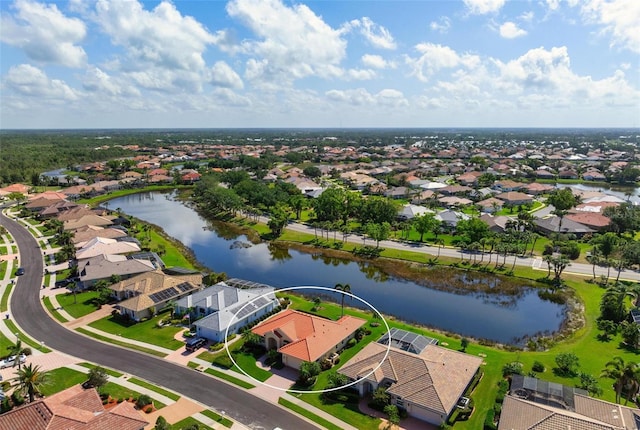 birds eye view of property with a residential view and a water view