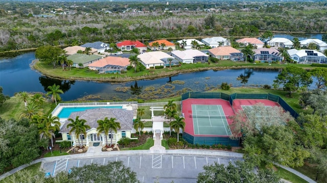 birds eye view of property with a water view and a residential view