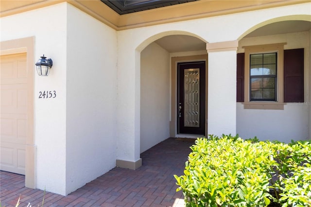 24153 Spartina Dr, Venice, FL 34293 - property entrance featuring stucco siding