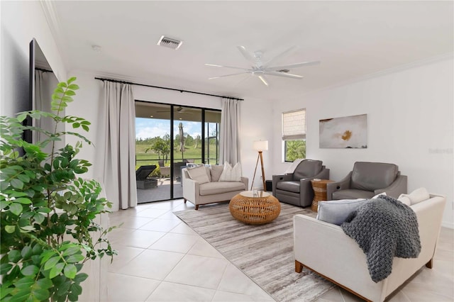 24153 Spartina Dr, Venice, FL 34293 - living room featuring light tile patterned floors, visible vents, a ceiling fan, and crown molding
