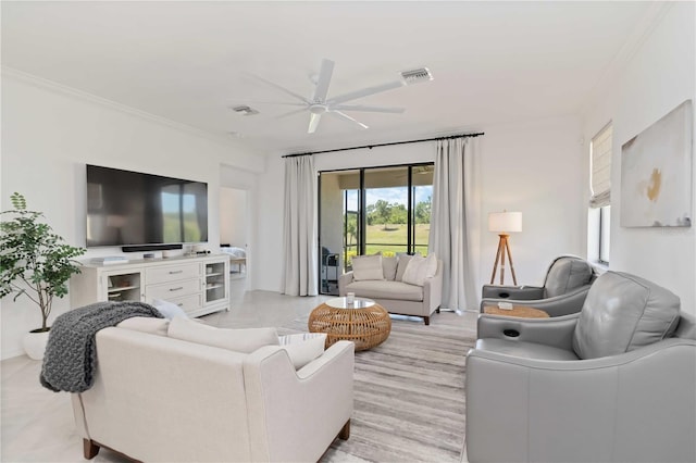24153 Spartina Dr, Venice, FL 34293 - living room with visible vents, crown molding, and ceiling fan