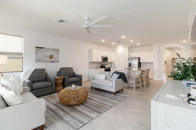 24153 Spartina Dr, Venice, FL 34293 - living area featuring arched walkways, a ceiling fan, visible vents, and recessed lighting