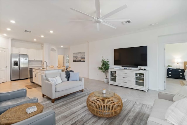 24153 Spartina Dr, Venice, FL 34293 - living room featuring crown molding, ceiling fan, visible vents, and recessed lighting