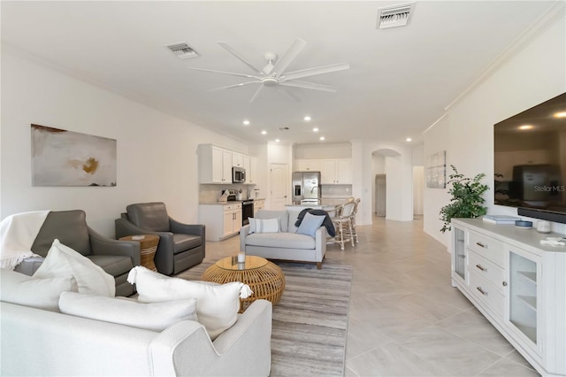 24153 Spartina Dr, Venice, FL 34293 - living room featuring recessed lighting, arched walkways, visible vents, and ceiling fan