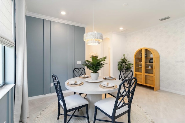 24153 Spartina Dr, Venice, FL 34293 - dining room with wallpapered walls, a notable chandelier, ornamental molding, and visible vents