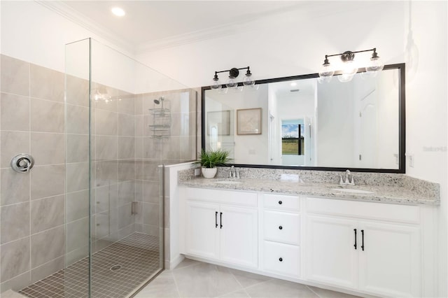 24153 Spartina Dr, Venice, FL 34293 - full bathroom with a sink, double vanity, a stall shower, and crown molding