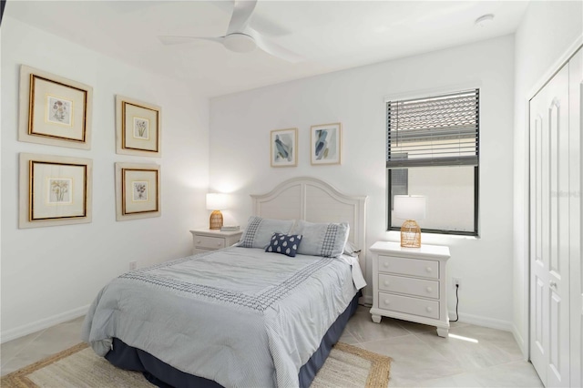24153 Spartina Dr, Venice, FL 34293 - bedroom with light tile patterned floors, ceiling fan, and baseboards