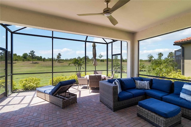 24153 Spartina Dr, Venice, FL 34293 - sunroom / solarium featuring outdoor lounge area, ceiling fan, and a wealth of natural light