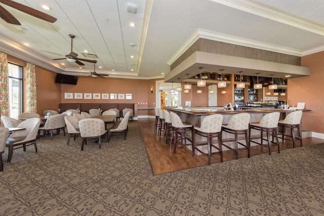 24153 Spartina Dr, Venice, FL 34293 - dining space with a tray ceiling, ceiling fan, baseboards, and a wealth of natural light