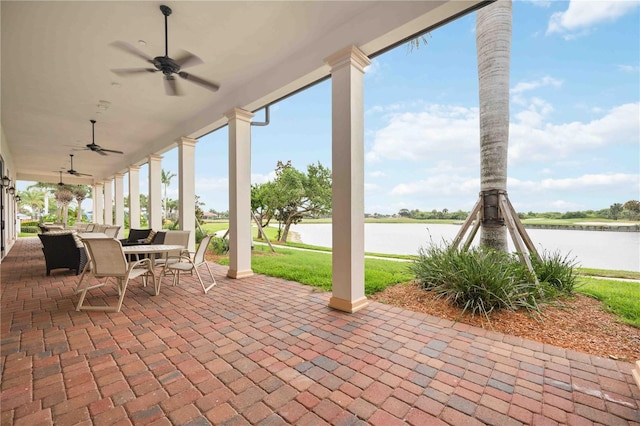 24153 Spartina Dr, Venice, FL 34293 - view of patio / terrace with a water view, outdoor dining space, and ceiling fan