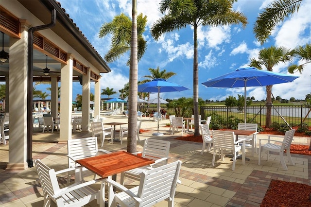 24153 Spartina Dr, Venice, FL 34293 - view of patio featuring outdoor dining space, fence, and a ceiling fan